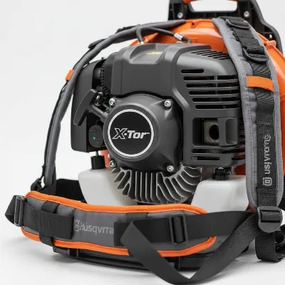 Close-up of Husqvarna 350BT engine and ergonomic harness system
